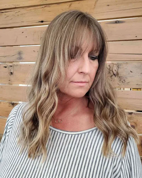 Long Blonde Soft Wavy Hair with Long Bangs Over 60