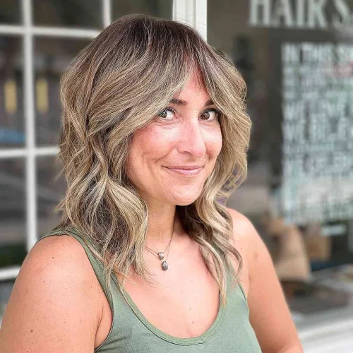 Blonde Mid-length Cut with Curtain Bangs over 40