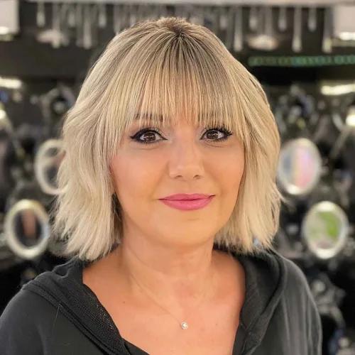 Modern Neck-length Blonde Cut with Bangs over 40