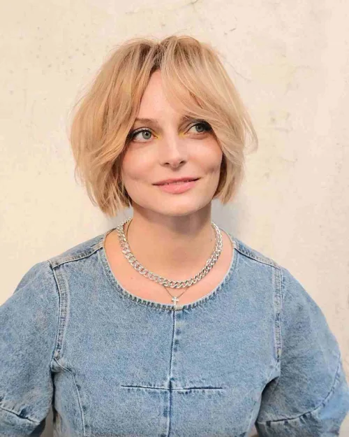 Tousled jaw-length bob face framing bangs over 40